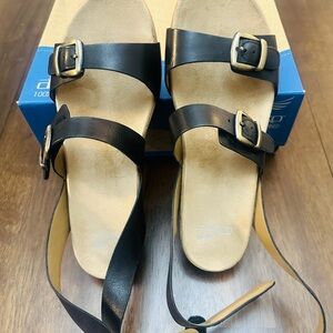 Dansko Black and Tan Women's Sandals
